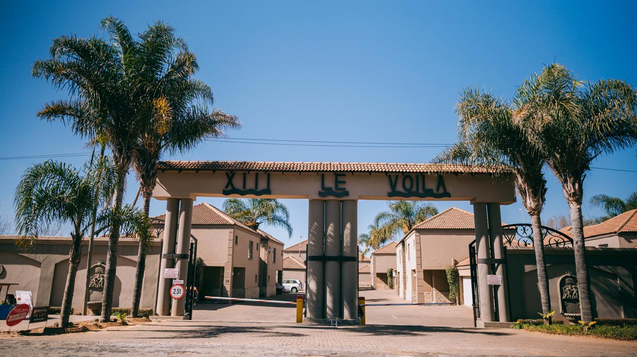 Le Voila estate entrance with palm trees