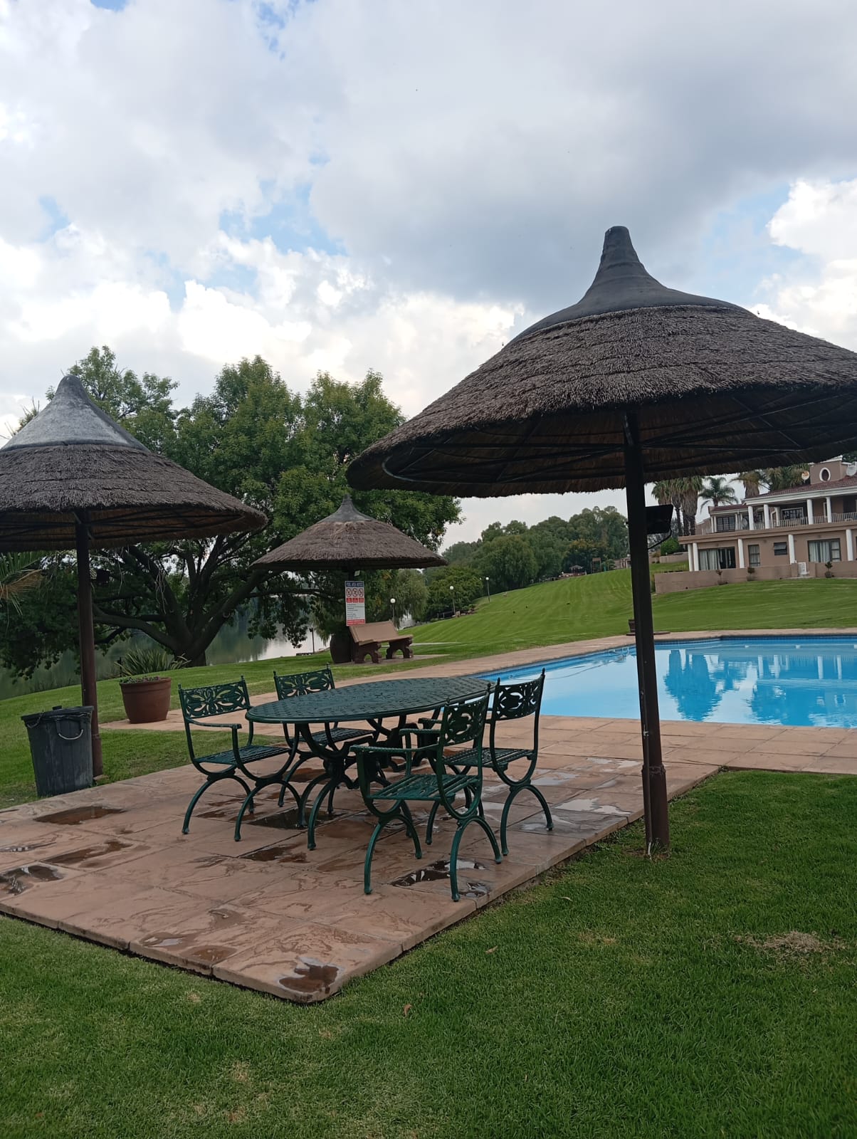 Villa poolside thatched umbrellas overlooking the Vaal River